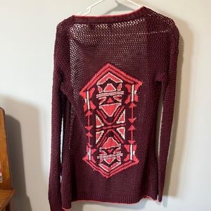 Deep red sweater